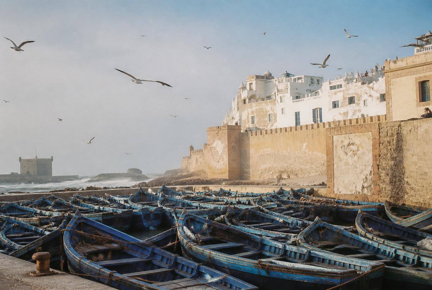 Essaouira ramparts with blue fishing boats and seagulls on the Atlantic coast