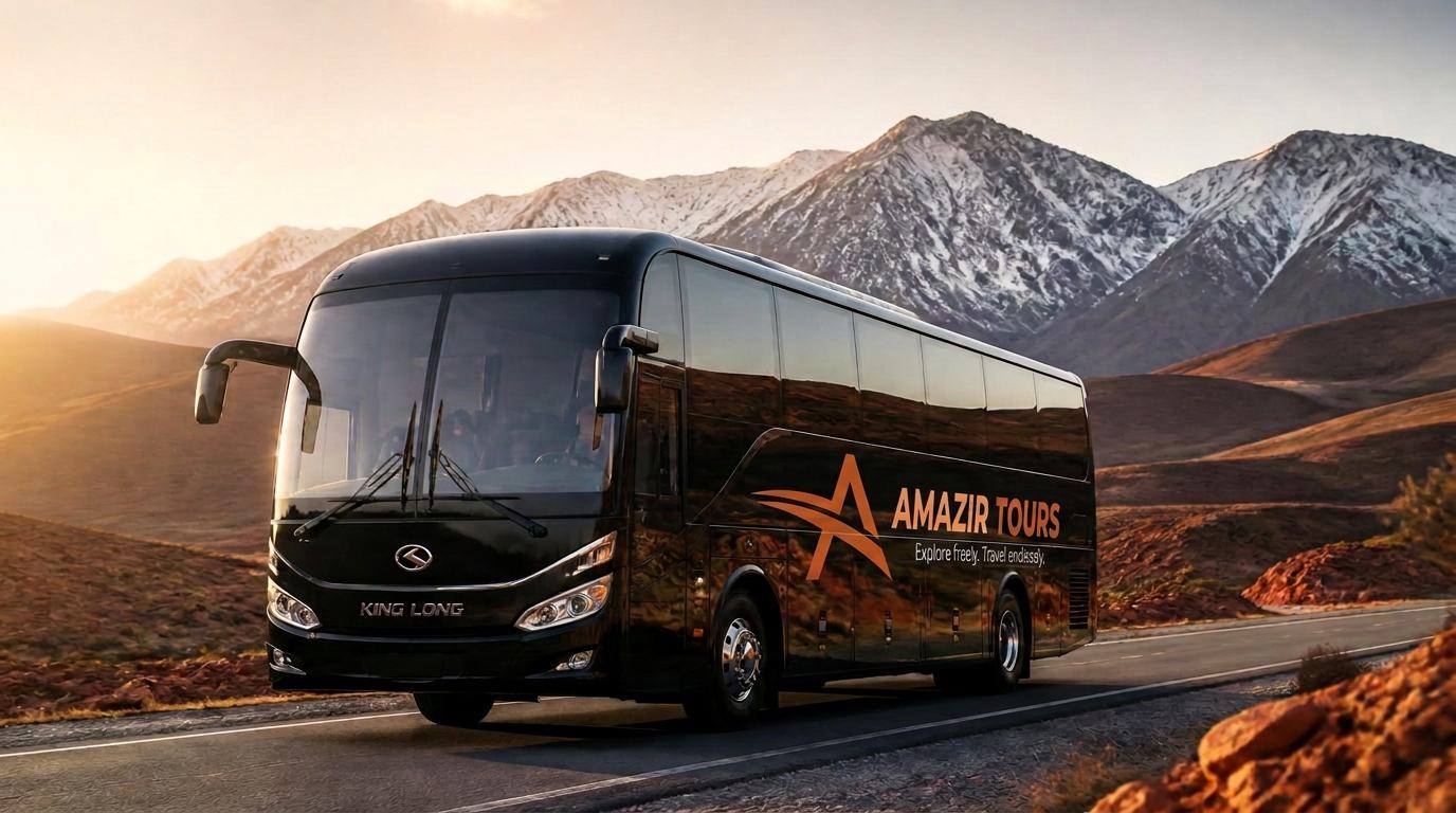King Long touring coach below snow-capped Moroccan mountains